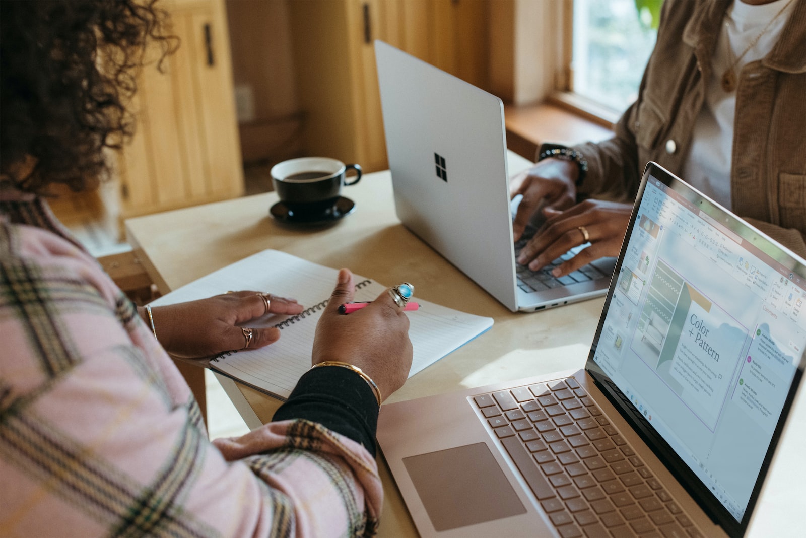 person using a Surface device to take note of their average computer science GPA